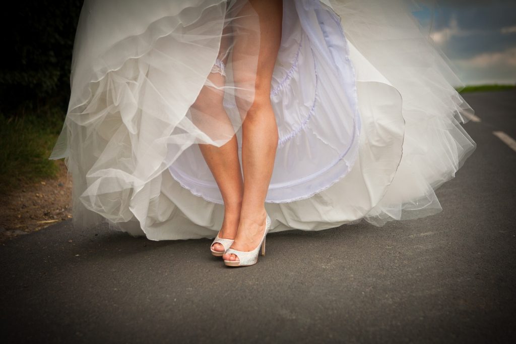 Brides legs in dress