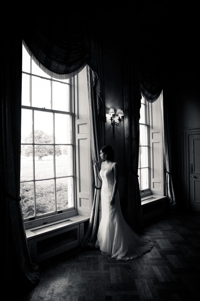 black and white photo of bride at hampton court house