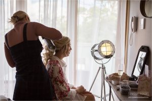 bride getting ready at cooling castle barn