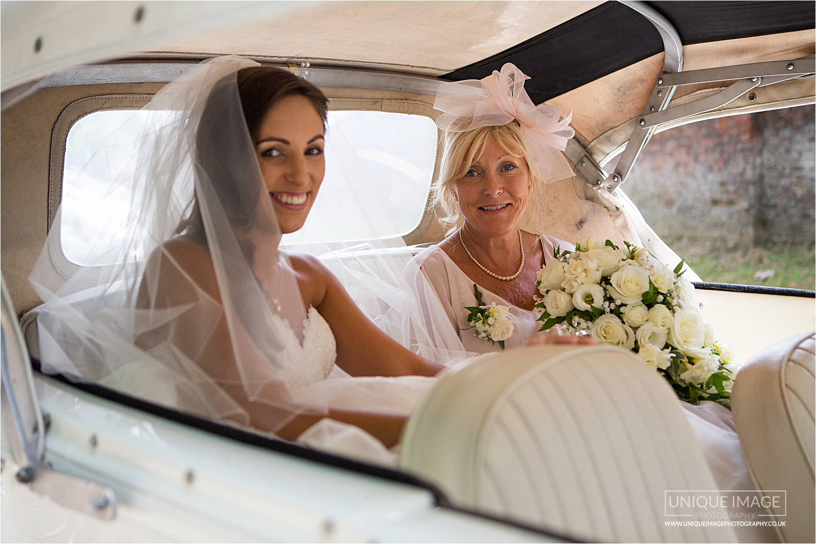 bride and brides mother arrive at church