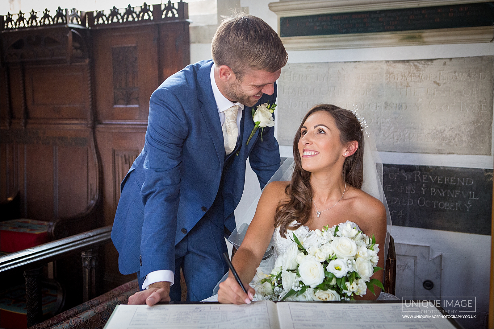 hapy couple signing the register