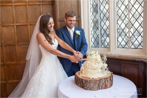 bride and groom cutting the cake