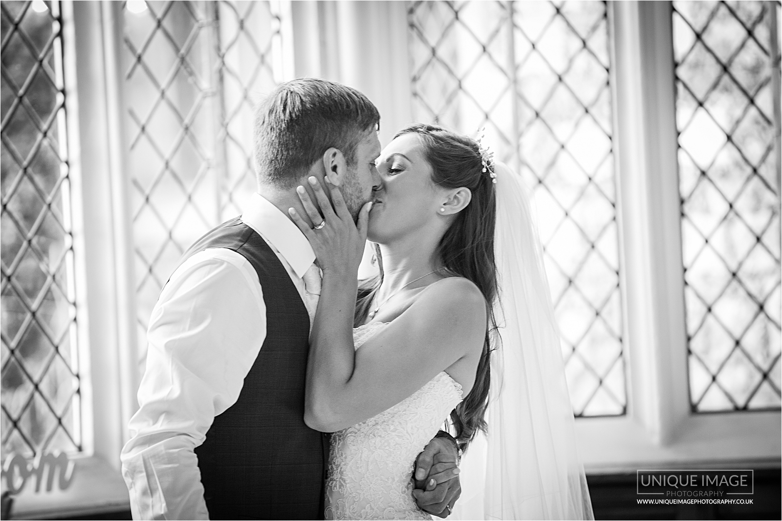 kissing bride and groom