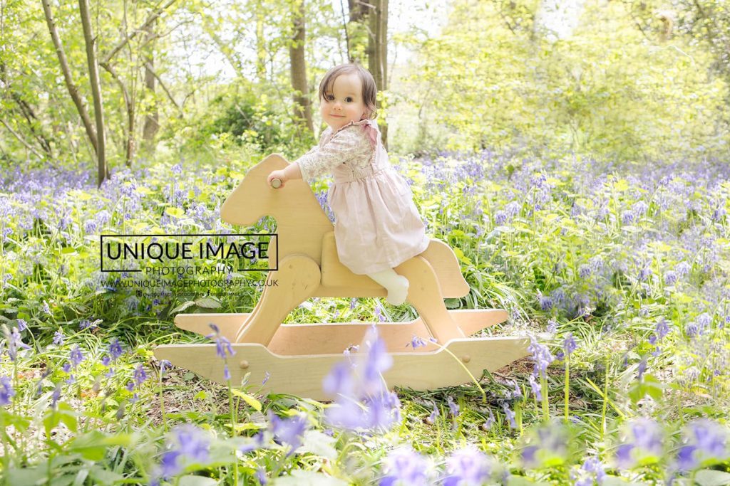 toddler smiling in the bluebells in bromley